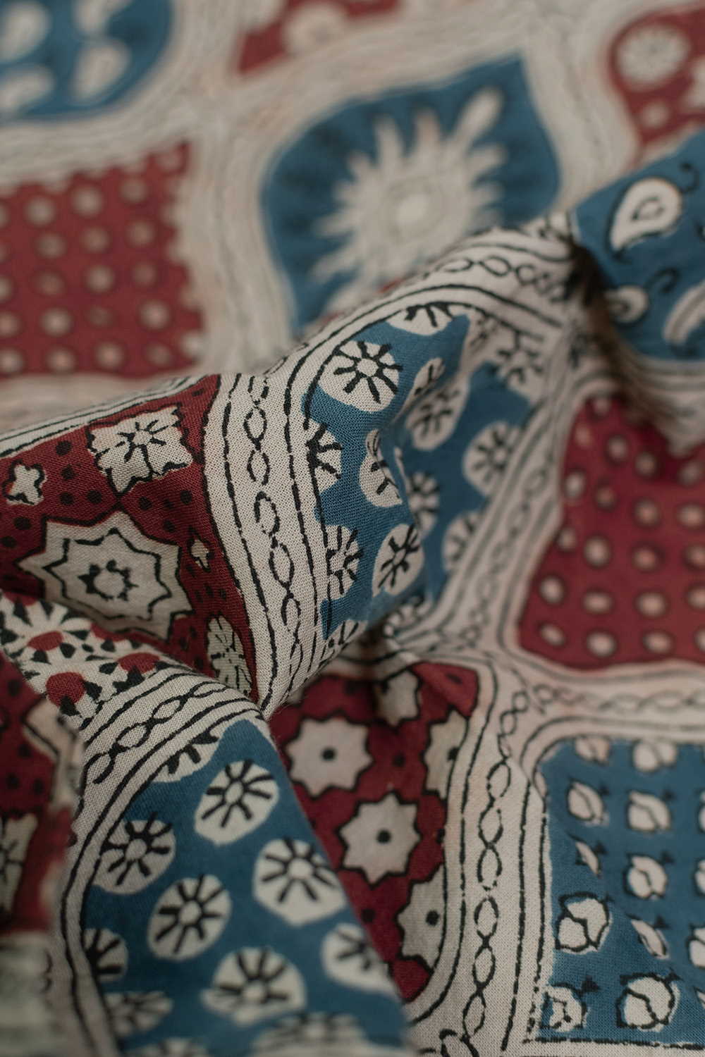 Colored Motifs on Cream Ajrak Cotton Fabric - Image 2