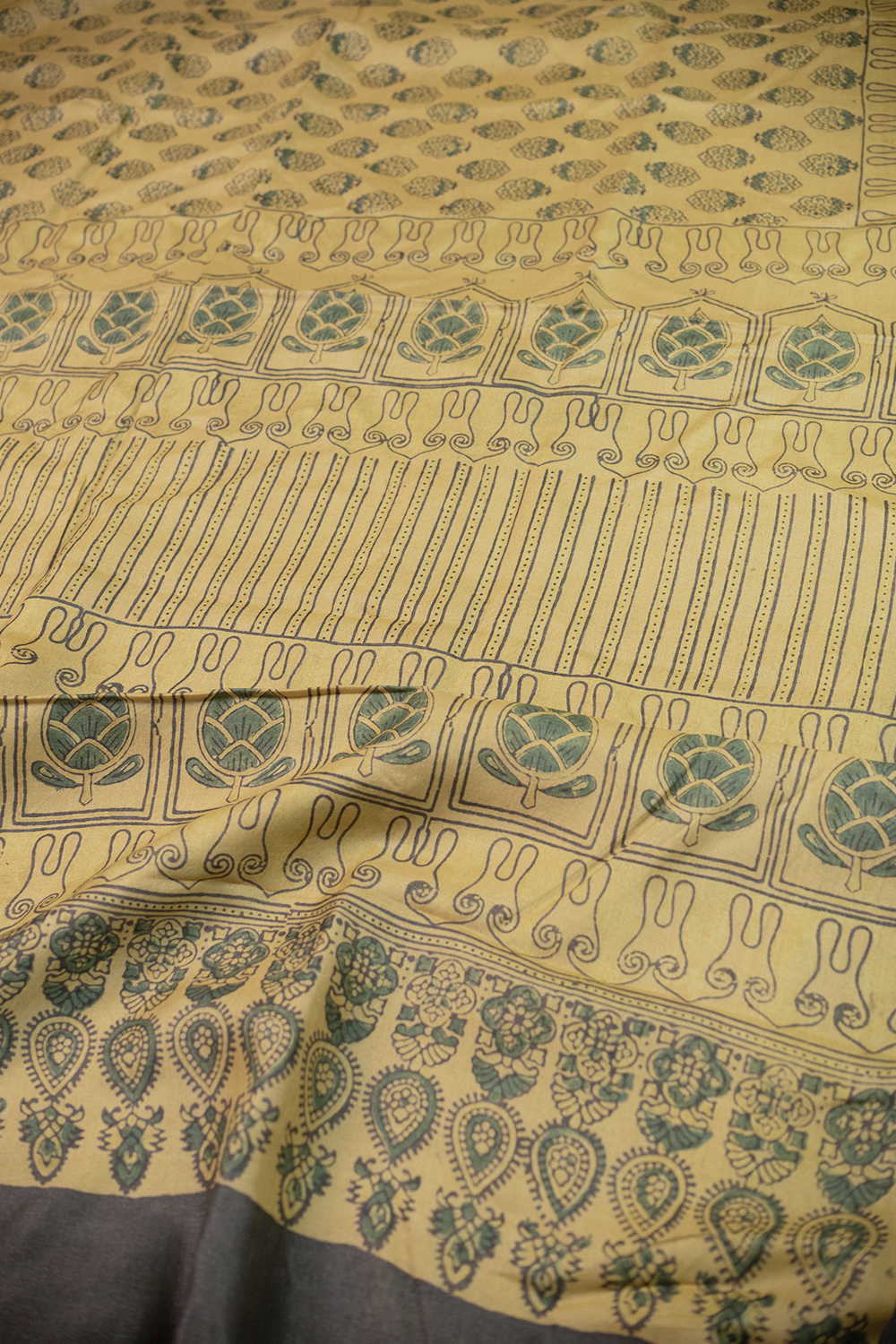 Buttas on Subtle yellow Ajrak Tussar Silk saree - Image 3