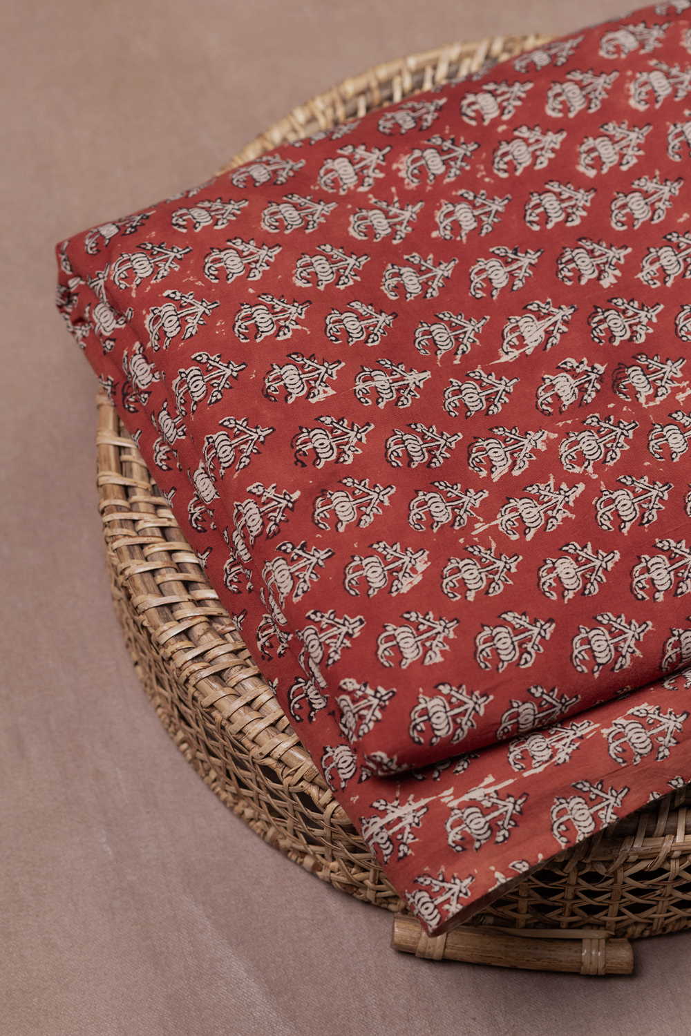Buttas on Maroon Bagru Cotton Fabric