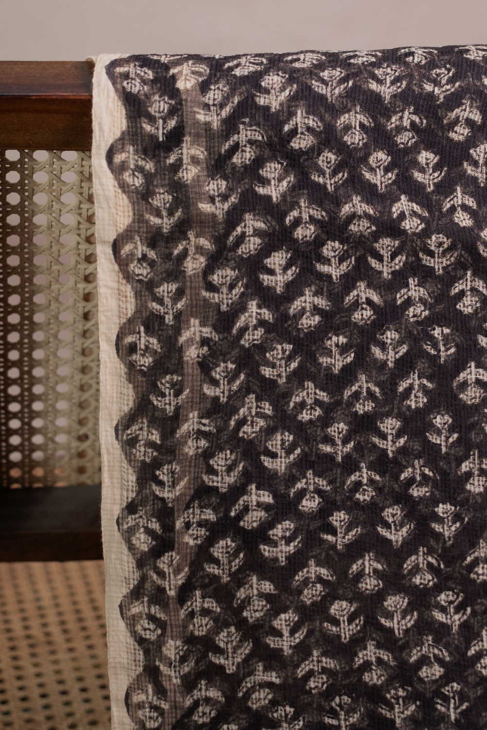 Motifs on Black Block Printed Kota Cotton Fabric