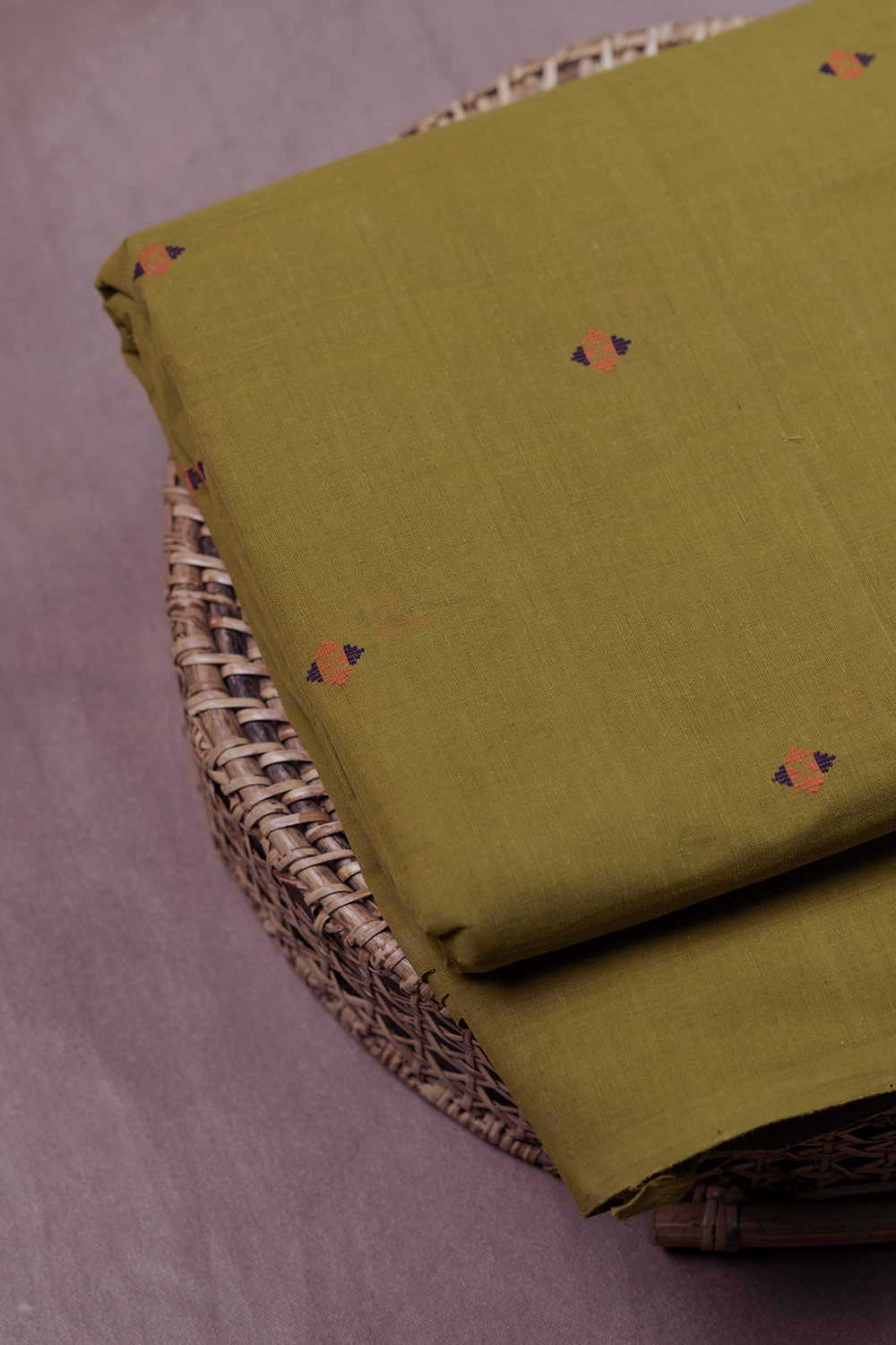 Buttas on Green Handwoven Cotton Fabric