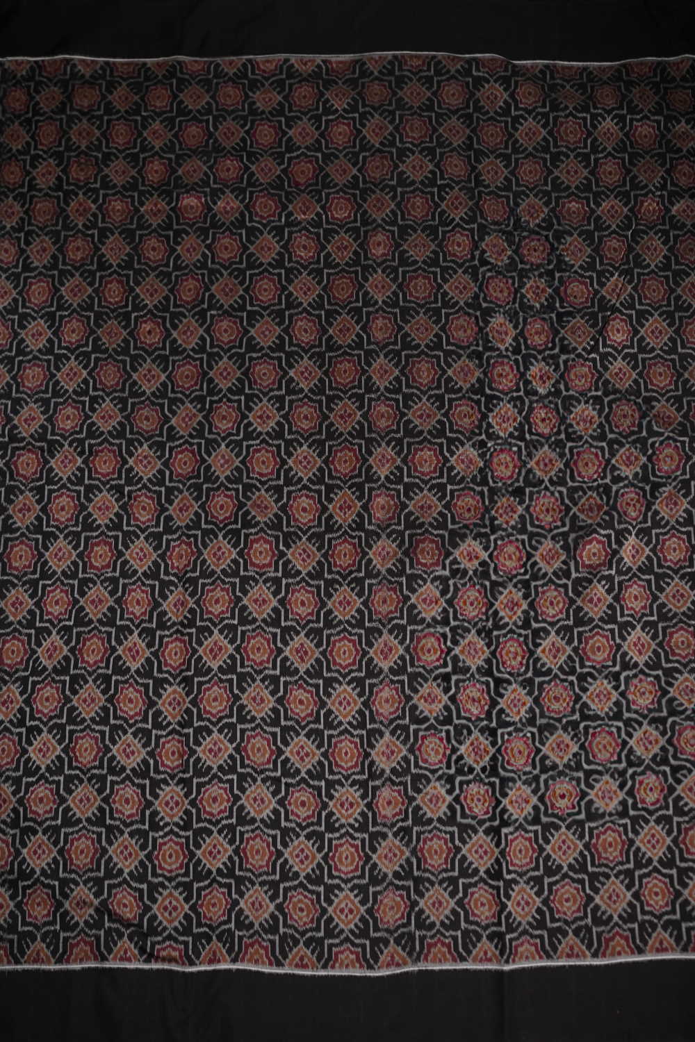 Patterned on Black Orissa Ikat Cotton Fabric - Image 4